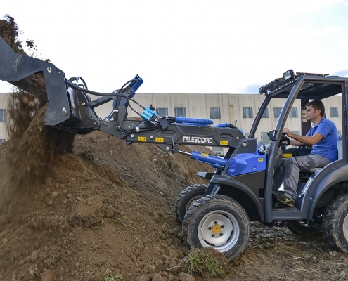 Combo Bucket by MultiOne dumping the load