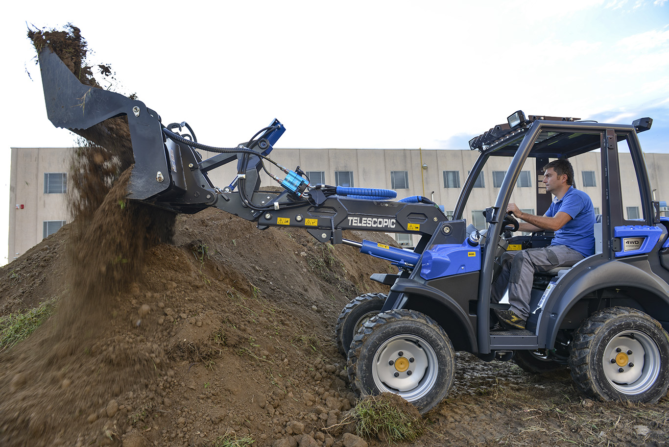 Combo Bucket by MultiOne dumping the load